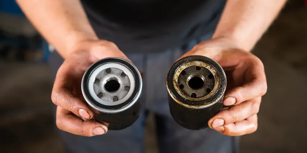 How to remove oil sludge and carbon deposits from the air compressor?
